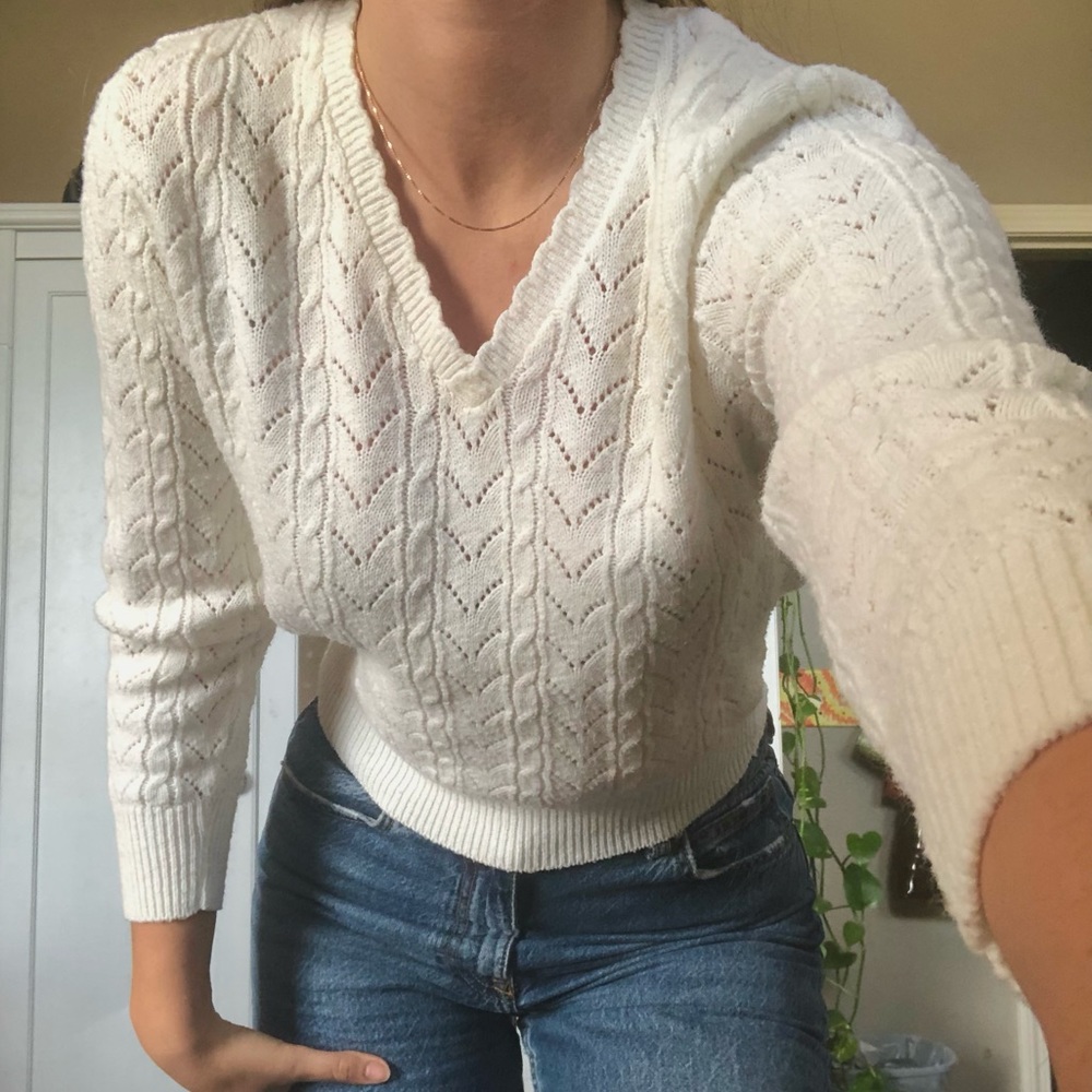 white sweater with v neckline